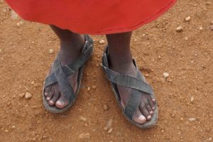 Maasai people wear shoes made from old rubber tires
